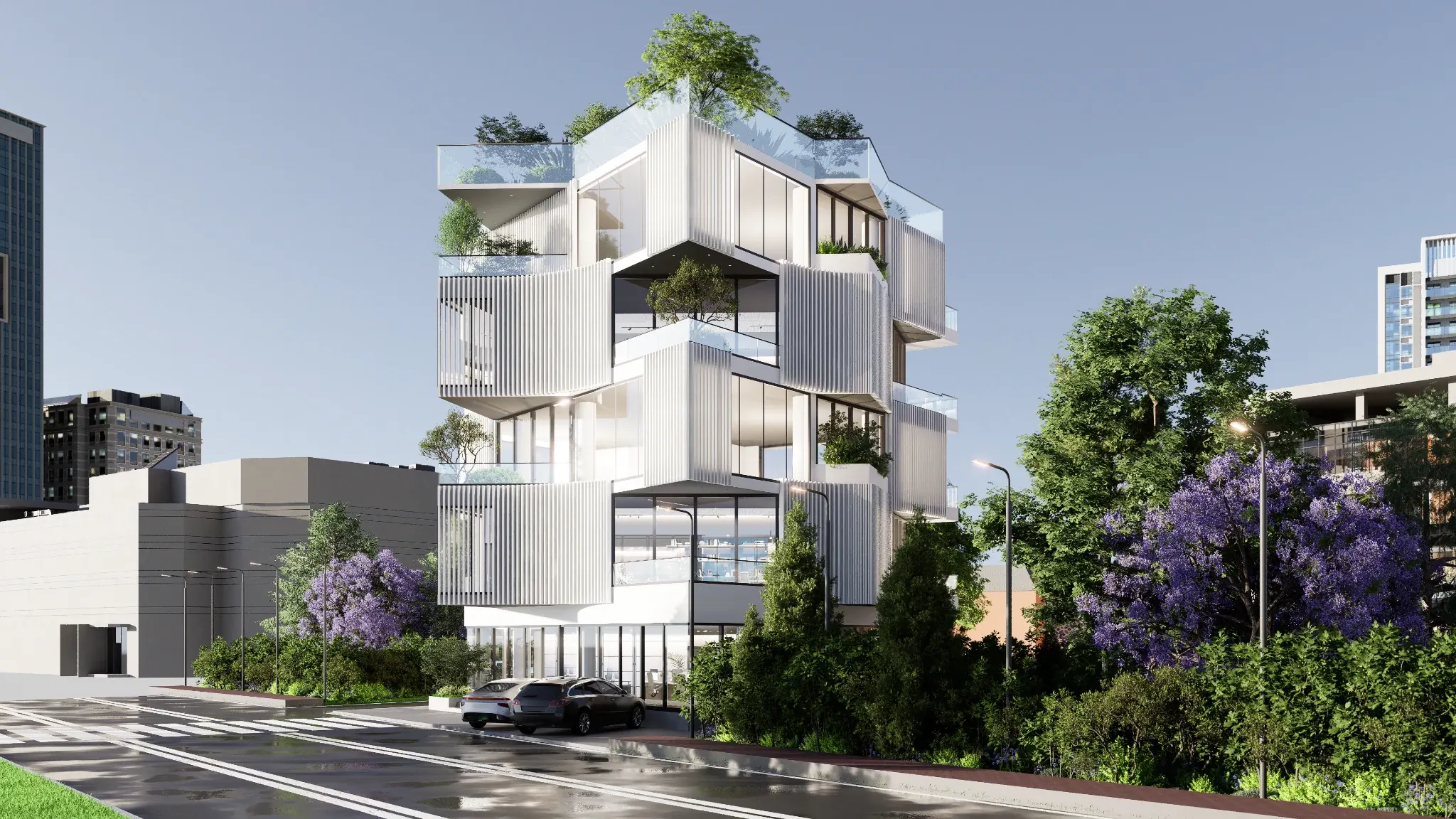 Daylight view of the building from across a landscaped intersection